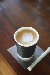 coffee paper cup on the wooden table