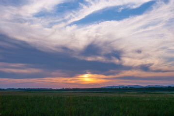 Blurred focus. Evening sky in the village.