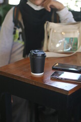 Plakat coffee paper cup on the wooden table