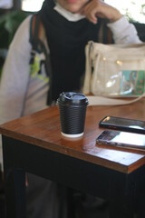 coffee paper cup on the wooden table