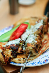 Grilled chicken shish tavuk and naan.selective focus