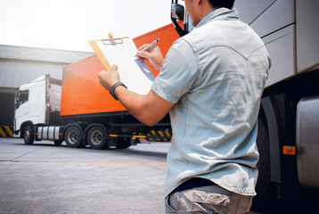 Truck Driver is Checking the Truck's Safety Maintenance Checklist. Lorry. Inspection Semi Truck...
