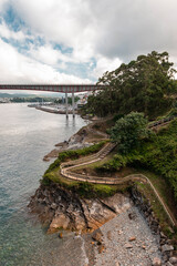 Coastal path with bridge in the background