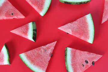 slice of watermelon on red background