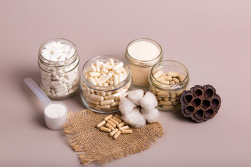 Nutritional supplements in beautiful composition from above in rustic style on light background....
