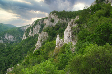 Fototapeta na wymiar Amazing mountain landscape - covered with green forest slopes of the Larazev canyon in Eastern Serbia