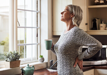 Already feeling better. Cropped shot of a relaxed senior woman preparing a cup of tea with CBD oil inside of it at home during the day.