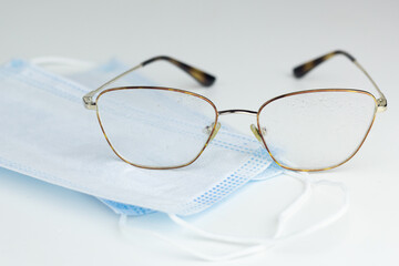 Glasses are being cleaned with anti-fog spray.