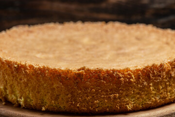 Homemade sponge cake on wooden table, Bakery background concept