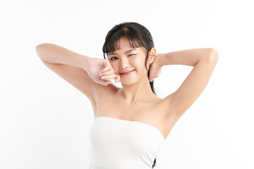 Obraz premium Beautiful Young Asian woman lifting hands up to show off clean and hygienic armpits or underarms on white background, Smooth armpit cleanliness and protection concept