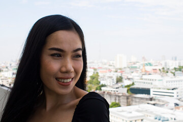 Young asian woman smiling happy on the city background