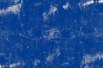 Dark blue grunge textured old cement plaster wall surface with cracks for background
