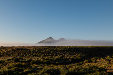 Fototapeta na wymiar Landscape of volcanic mountains in Cabo de Gata Nature Park, Almeria, Spain, during sunrise
