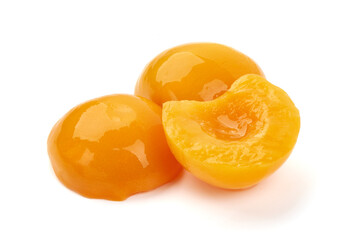 Juicy canned peach halves, isolated on white background.