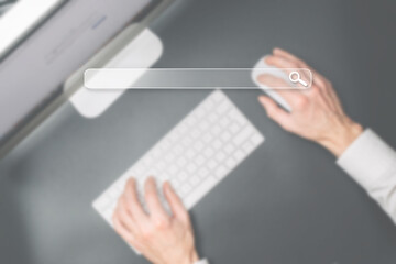 Searching internet. Online website search engine selective focus. Blured hands using computer for searching browsing internet data information networking concept.