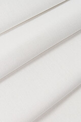 folded cotton white sheet. macro. addition example