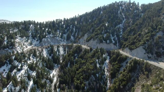 Big Bear Aerial Shot of Winter Snow San Bernardino Mountains Descend California USA