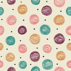 Seamless abstract background with polka dots in retro colors. Great for fabrics, prints, wallpapers and other surfaces.