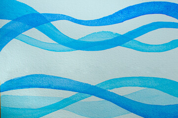 Blue stripes in the form of a wave on a white textured paper painted in watercolor.