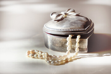 Old vintage silver jewelry box in heart shape. Strands freshwater pearls.  Bridal accessories....