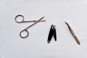 Manicure accessories scissors and file on a white background