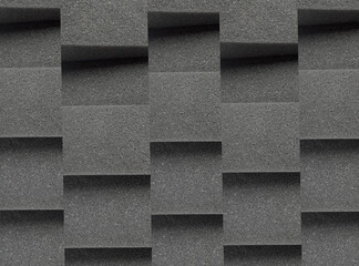 black sponge foam surface texture. background with elegant checkered pattern