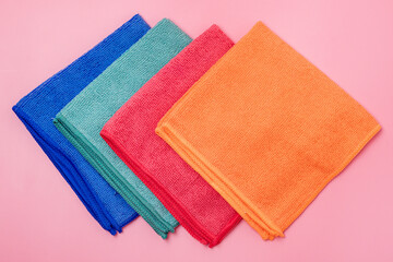Colored Microfiber Napkins for Cleaning a Top View on a Pink Background Horizontal