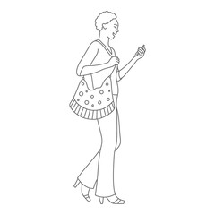 Beautiful fashion woman walking and using phone.