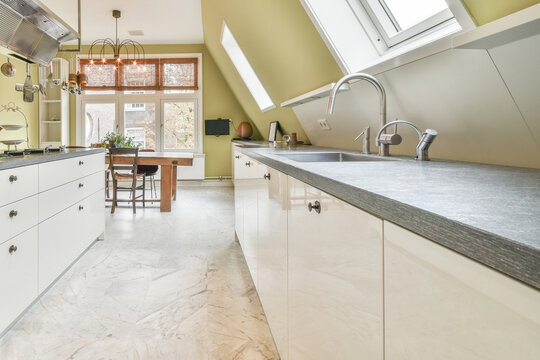 Kitchen counter with sink near window