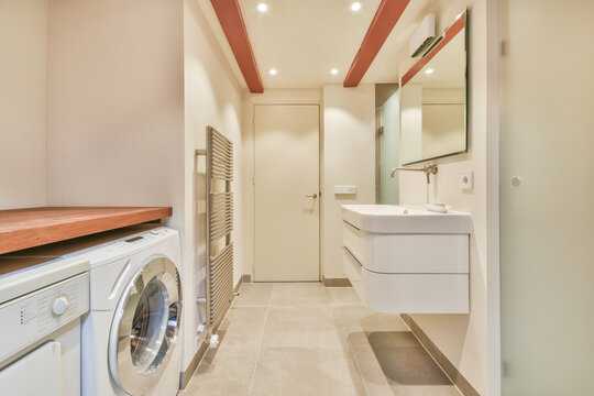 Sink with washing machine in bathroom
