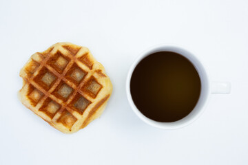 Obraz na płótnie Canvas Top view of Coffee cup and waffle on white background