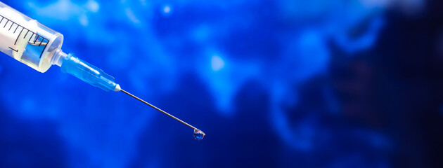 Coronavirus coivd-19 and omicron variant background. Syringe needle close-up, world epidemic and...