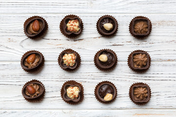 Different kinds of chocolates on colored table close-up. Top View and Flat Lay