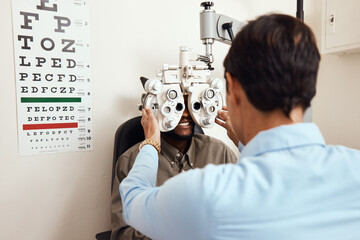 It's always worth seeing an optometrist. Shot of an optometrist examining her patients eyes with an...