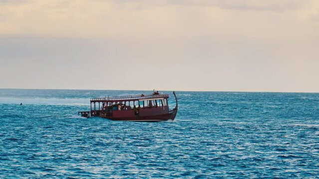 Traditional Dhoni boat moves in the sea