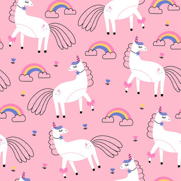 WebSeamless vector pattern with cute unicorns and rainbow on pink background. Perfect for textiles and wrapping paper.