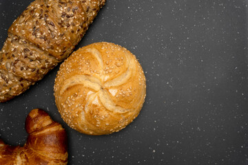 Assorted breads on dark background