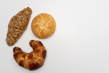 Assorted breads on white backgrounds