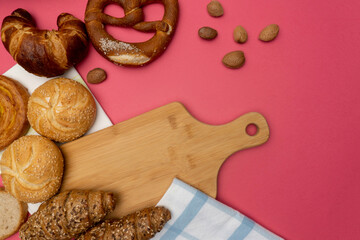 Lots of loaves of fresh bread and different ingredients.