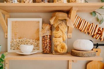 organization of storage on shelves in the kitchen is made of wood.