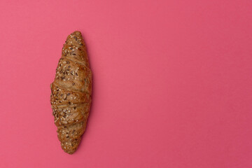 French croissant on a pink background