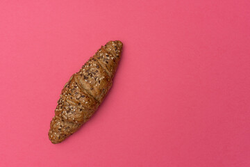 French croissant on a pink background