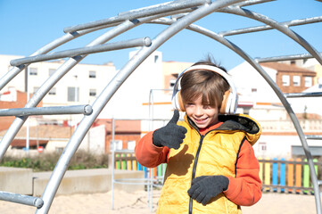 child with raised finger all perfect on the playground