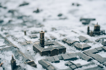 Lviv, Ukraine - January 19, 2022 : Lviv City Hall bronze miniature model with snow. Lviv tourist attraction for winter season