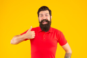 hair and beard care. surprised male face portrait. thumb up. mature hipster with beard.
