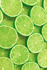 Fresh lime slices as a background.