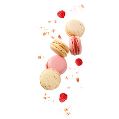Sweet macaroons macarons with raspberry berries and crumbs flying isolated on  white background.