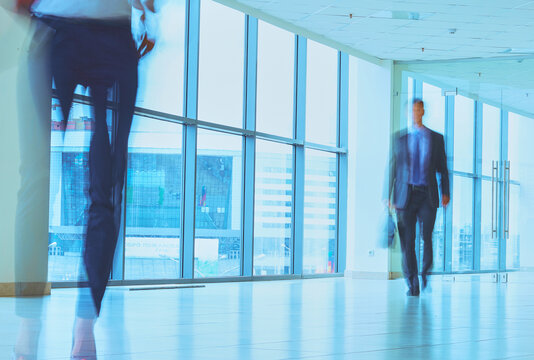Businesspeople walking in the corridor of an business center