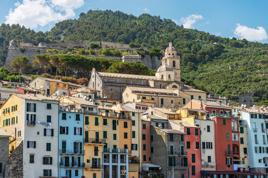 Cityscape of Porto Venere or Portovenere village, view from the sea with the colorful houses-tower, UNESCO world heritage site, Gulf of La Spezia, Liguria, Italy, Europe.