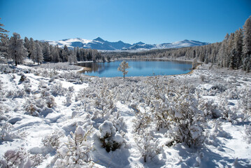 Lake in the mountains. Winter. Mountain landscape. Lake Kidel. Altai.